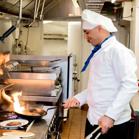 Williams Place Chef Created Meals, chef frying a dish.